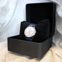 The Camy Geneve watch displayed within a black watch box, providing a presentation view of the timepiece.