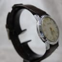 Side profile of Allaine watch showing chrome-plated case and crown details