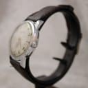 Close-up of brown leather aftermarket strap and simple buckle