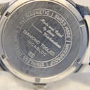 Engraved stainless steel case back of Allaine watch, 'Swiss Made' inscription