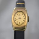 Front view of vintage Oris ladies' watch with gold oval dial and black leather strap.