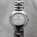 Front view of Tissot G330 women's watch with white dial and integrated stainless steel bracelet.