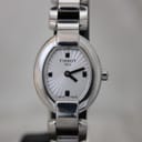 Front view of the Tissot G332 women's watch, showing its oval polished stainless steel case and sunburst silver dial with minimalist black markers.