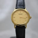 Front view of the Tissot C226K, showing gold-tone case and champagne dial with baton markers.