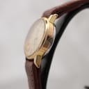 Detailed view of the champagne dial with baton markers and Tissot logo.