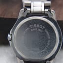 Detail shot of the Tissot PR 50 silver dial with black baton indices