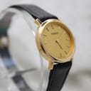 Another angled view of the Tissot C225K watch from a slightly different angle, highlighting the gold-plated case and dial.