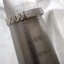The Tissot PR 50 watch bracelet on a wrist sizing gauge, indicating an approximate wrist size of 172mm.