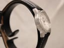 Close-up of the Tissot PR 50's white dial, applied indices and date.