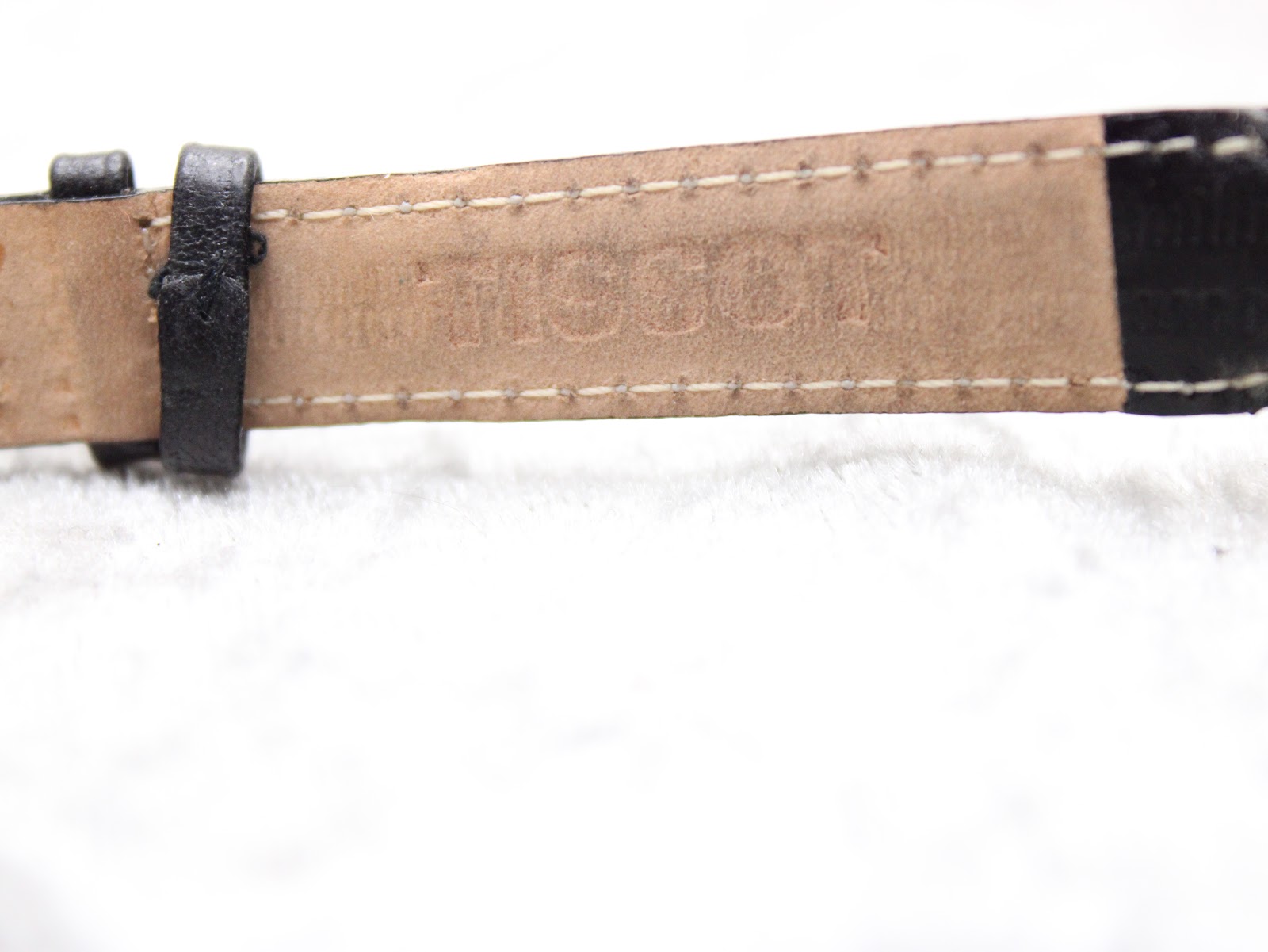 Rear view of the Tissot PR 50's signed stainless steel case back.