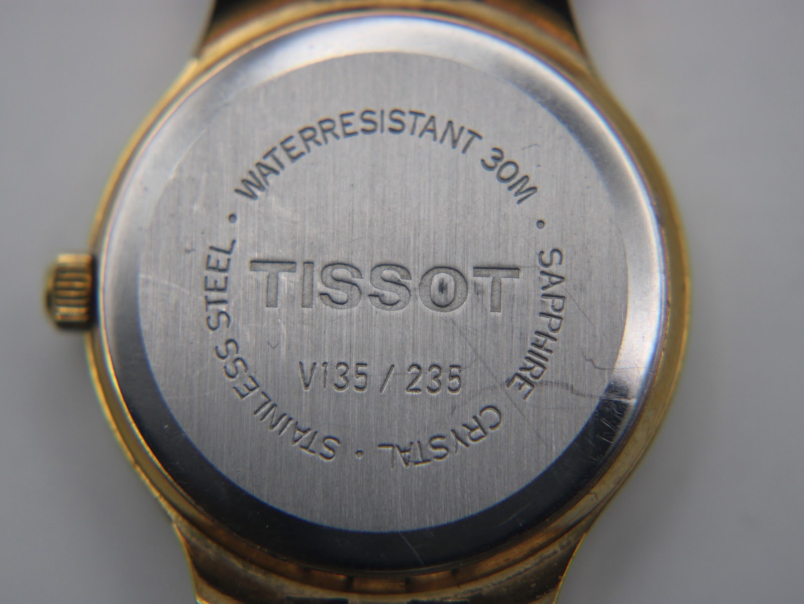 Detail of the Tissot Stylist black leather strap.