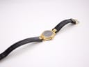 Rear view of Tissot Stylist gold-tone case.