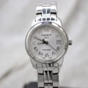 Front face of Tissot PR 100 women's watch with silver Roman dial and date window.
