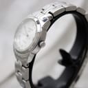 Side profile of Tissot PR 100 stainless steel case and integrated bracelet.