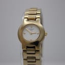 Front view of Tissot G331K gold-tone quartz watch with white dial, gold hands, and small baton indices.