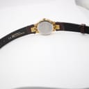 Rear view of the watch with the brown leather strap laid flat, showing "14 H Hirsch Lizardgrain" branding on the inside of the strap.