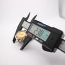 Digital caliper measuring the case diameter of the Tissot Seastar, displaying a precise reading of 23.8mm.