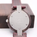 Close-up of the stainless steel case back of the Tissot Rock Watch, engraved with "Genuine RockWatch", "Swiss Quartz", "R 150", and reference "907".