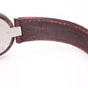 Close-up of the interior of the red leather strap, showing the embossed "TISSOT" logo.