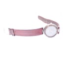 Side profile view of the Tissot Rock Watch and its red leather strap, laid flat.