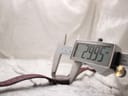 Digital caliper measuring the case diameter of the Tissot Rock Watch, displaying a precise reading of 29.95mm.