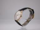 Side profile of gold-plated Tissot case with original signed crown.