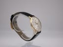 Close-up of Tissot Seastar Seven silver sunburst dial with gold indices.