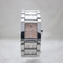 Front view of the Tissot L840 K ladies square watch with salmon pink dial and stainless steel bracelet.