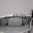 Close-up of the Tissot signed crown and the detailed engravings on the brushed stainless steel case back.