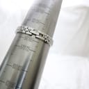 The Tissot G334 watch bracelet wrapped around a metal wrist sizing gauge, indicating a maximum wrist circumference of approximately 160mm.