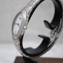 Side view of the Tissot L720 watch, showing the oval stainless steel case and integrated bracelet.