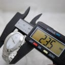 Digital caliper measuring the Tissot L720 watch case, displaying a width of 23.5mm.