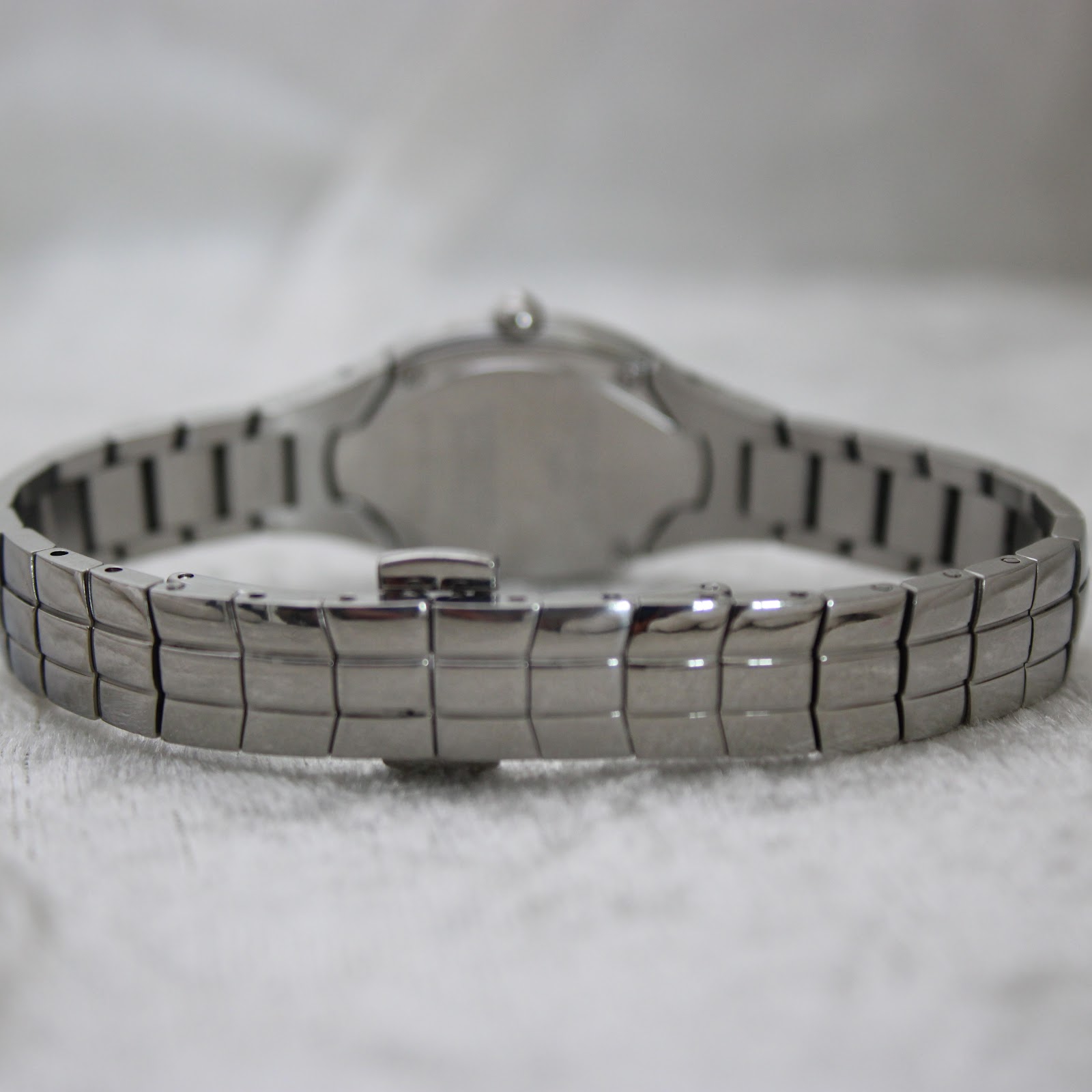 Rear view of the Tissot L720 integrated stainless steel bracelet with the clasp closed.