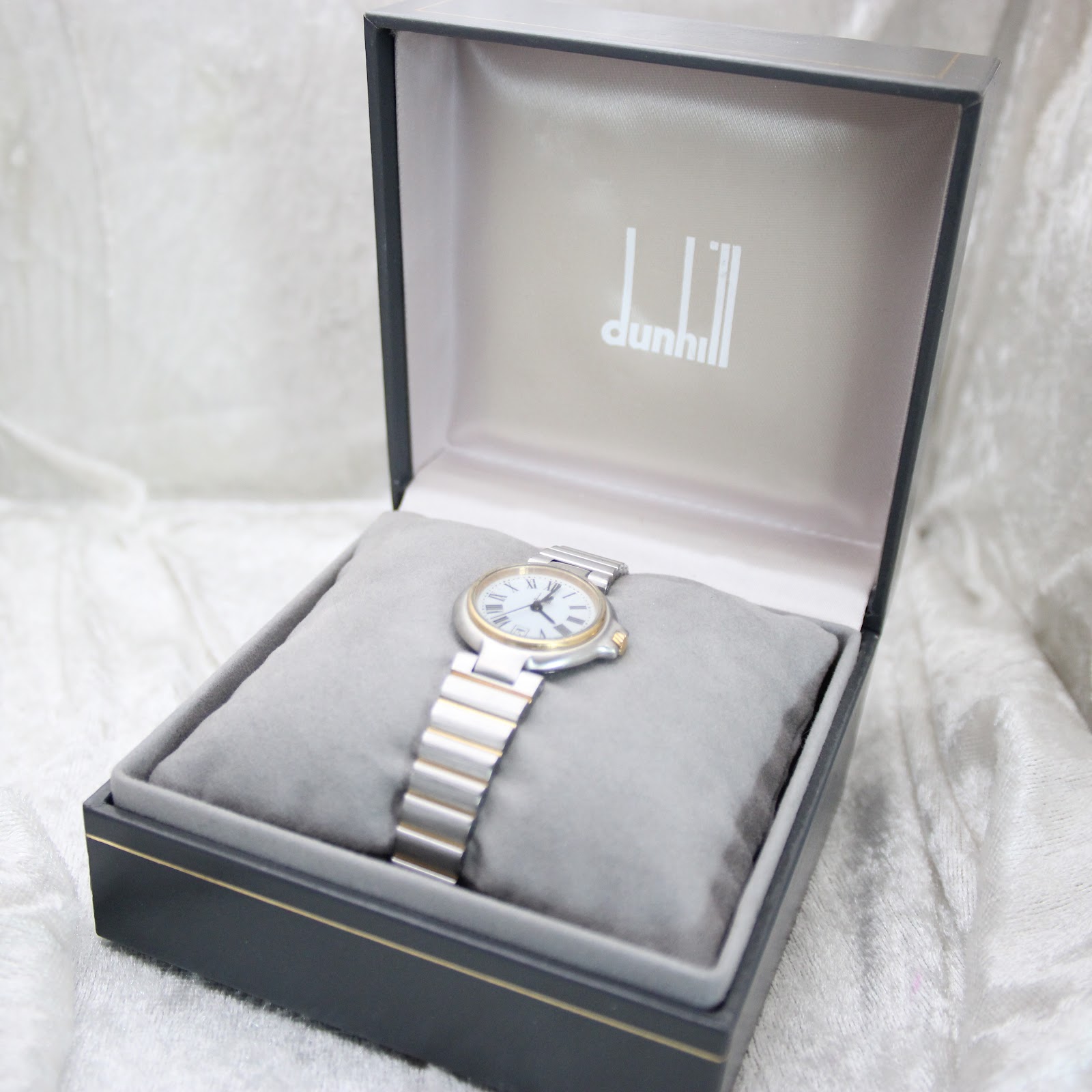 Dunhill watch presented in its original dark grey and gold-accented presentation box.