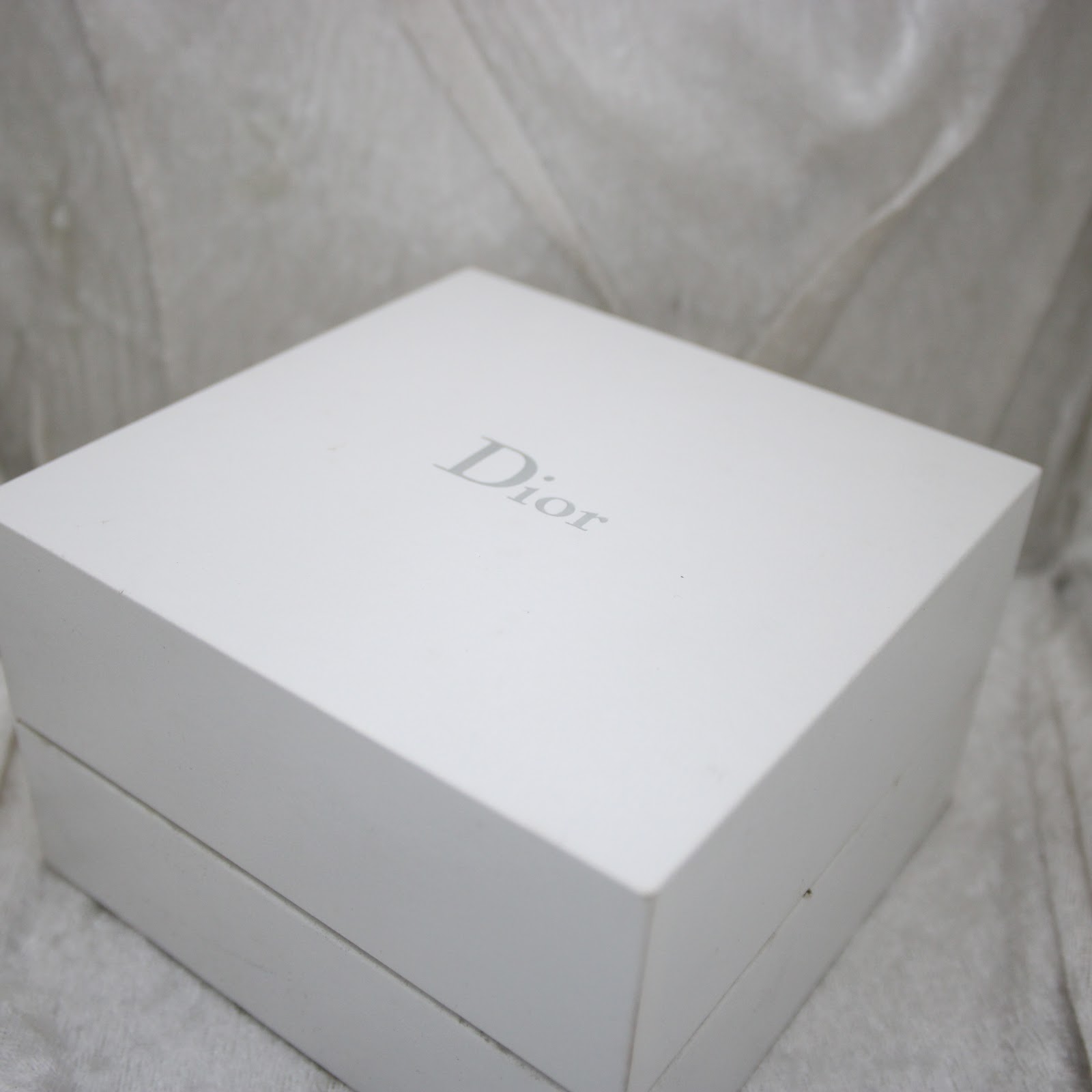 Original Christian Dior presentation box in white with "Dior" logo.