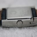 Side view of the watch case, showing the ridged crown with a "CD" logo.
