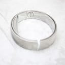 Another angle of the polished stainless steel bangle watch's integrated clasp mechanism, open.