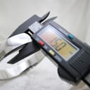 Digital caliper display reading 150.0 mm, measuring the internal circumference of the watch's integrated bangle bracelet.