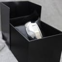 The Calvin Klein bangle watch nestled inside its original black presentation box with a velvet interior.