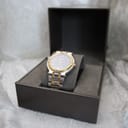 The Gucci 9000G watch displayed inside its original brown Gucci presentation box with a grey interior.