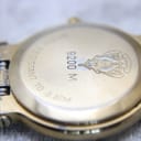 Close-up of the watch case back showing 'GUCCI 9200 M' engraving, interlocking G logo, and 'WATER RESISTANT TO 3 ATM'.