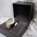 Overview of the Gucci watch resting securely in its open original presentation box.