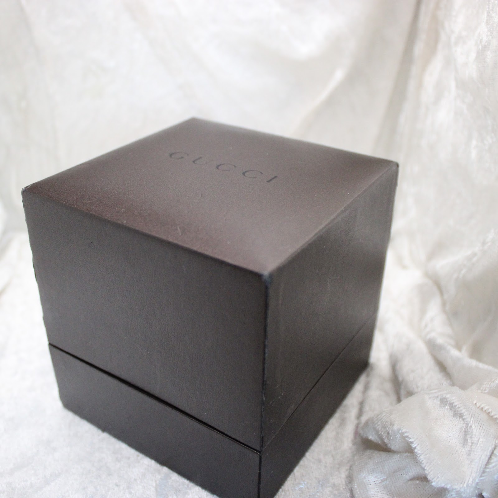 Top view of the closed original brown Gucci presentation box.