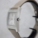 Side view of the Gucci 7700M showing the polished stainless steel case and signed crown.