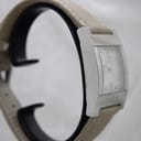 Another side view of the Gucci 7700M, highlighting the case profile and beige strap.