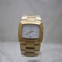 Front view of gold-tone Gucci 8500L ladies' watch with white dial and applied gold indices on a white background.