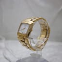 Angled side view of the gold-tone Gucci 8500L watch, showing the cushion case profile and crown.