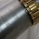 Watch bracelet wrapped around a wrist sizing gauge, indicating a wrist size of approximately 155mm or 15.5cm.