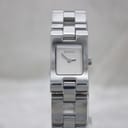 Slightly closer front view of the Gucci 2305L watch, highlighting the brushed silver dial, 'GUCCI' logo, and polished stainless steel case and bracelet links.