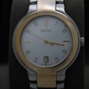 Close-up front view of the Gucci 8900M's white dial, showing gold-tone markers, hands, and a date window at 6 o'clock.